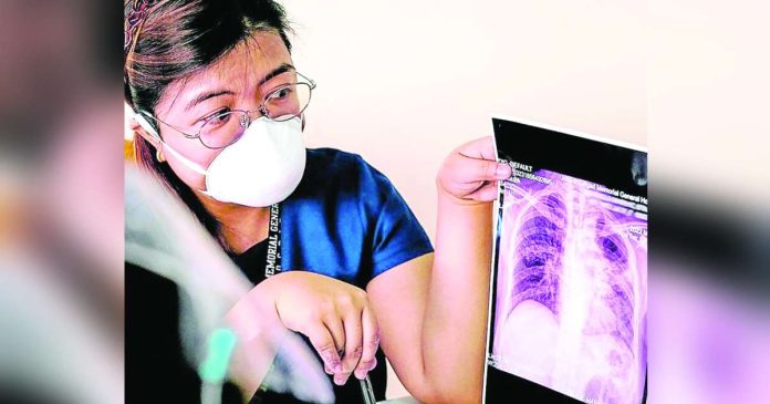 DOH copy_superimposed A health worker explains tuberculosis treatment at a learning center launched in Manila in March 2024. FILE PHOTO FROM TB ALLIANCE WEBSITE