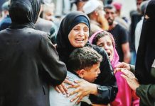 Famine confirmed in Gaza for first time, says UN A Palestinian woman hugs a young boy, with other crying people around them. Gaza City and its surrounding area are now experiencing famine. GETTY IMAGES