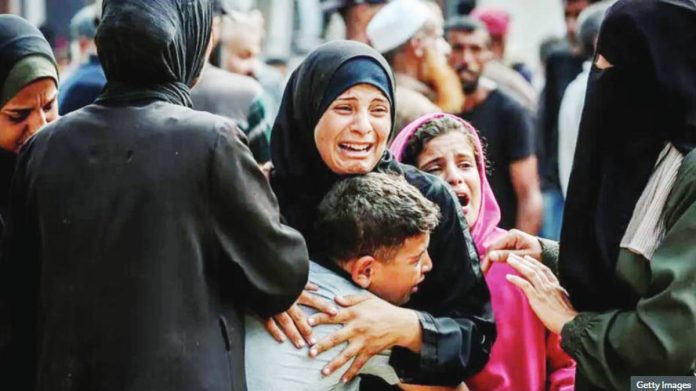 Gaza.JPG_resized A Palestinian woman hugs a young boy, with other crying people around them. Gaza City and its surrounding area are now experiencing famine. GETTY IMAGES