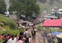 A screen grab of Chositi village shows a road full of people. A large number of people had gathered to visit a famous Hindu shrine. ANI