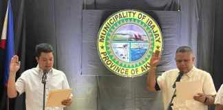 Senior Municipal Councilor Nestor Inocencio (right) takes his oath of office as the new vice mayor of Ibajay, Aklan, on Monday, August 11, 2025, succeeding the late Vice Mayor Julio Estolloso. The ceremony, held at the Sangguniang Bayan session hall, was administered by Mayor Jose Miguel Miraflores. IBAJAY LGU PHOTO