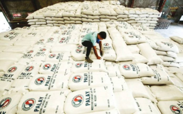 NFA buffer stock copy A warehouse staff inspects sacks of palay bought from farmers at the National Food Authority in Balagtas, Bulacan in this file photo. PNA PHOTO OF JOAN BONDOC