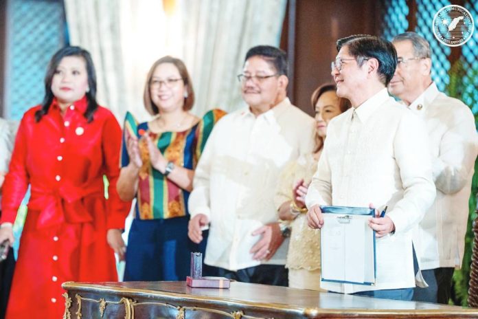 President Ferdinand R. Marcos Jr. said his government is committed to respecting the autonomy and authority of the Supreme Court as he highlighted strengthening the country’s democratic processes. He is shown here holding the Judiciary Fiscal Autonomy Act he signed at the Malacañang Palace. PCO