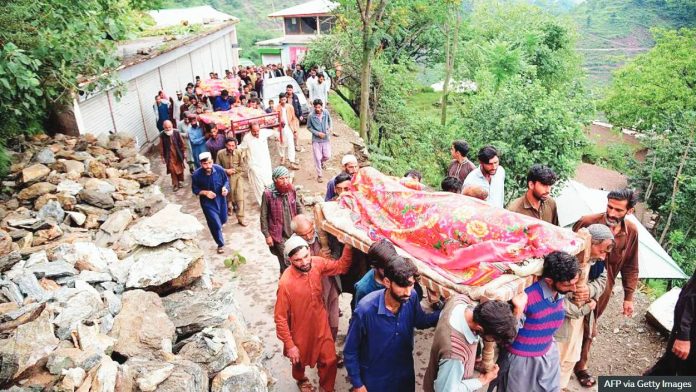 Pakistan Mourners carry the coffins of flood affected victims after flash floods in Naryean Behaak village some 36 km north from Muzaffarabad, the capital of Pakistan-administered Kashmir. AFP VIA GETTY IMAGES