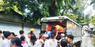 The City Disaster Risk Reduction and Management Office dispatched a rescue truck to help several students of Generoso Villanueva Sr. National High School in Barangay Granada, Bacolod City as floodwaters inside the school reached waist-deep level, on Aug. 20. BACOLOD CDRRMO PHOTO