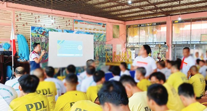 EMPOWERING SECOND CHANCES. A Department of Trade and Industry trainer discusses business planning with male Persons Deprived of Liberty during a financial literacy and entrepreneurship training at the Iloilo City District Jail on August 1, 2025. The activity, part of a broader Jail Pantry Program, aims to equip inmates with livelihood skills for reintegration into society.