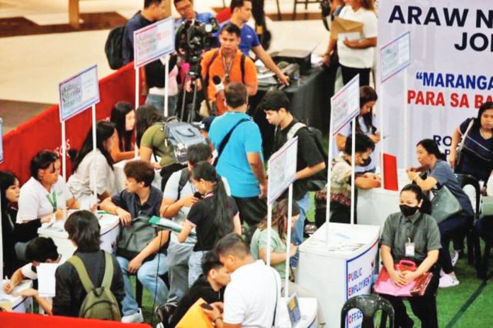 Jobseekers, most of them fresh college graduates, line up at a job fair organized by the Public Employment Service Office of Manila and the Department of Labor and Employment at a shopping mall in Manila in June 2025. DANNY PATA PHOTO