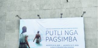 A large banner announcing the 2025 Jehovah’s Witnesses Regional Convention with the theme “Putli nga Pagsimba” (Pure Worship) is displayed outside the Iloilo Convention Center at the Iloilo Business Park in Mandurriao, Iloilo City, where thousands are expected to gather on August 8–10 and 15–17.