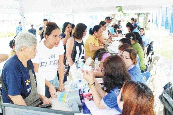 Residents from Jaro district avail themselves of government services during the 88th Iloilo City Charter Day at Jaro Plaza.