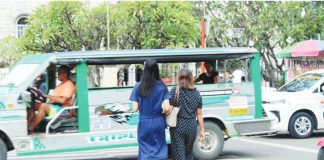 A mother and her daughter cross a pedestrian lane in Jaro, Iloilo City where advocates are calling for stronger human immunodeficiency virus awareness efforts that include not just the youth but also parents, whose beliefs can shape access to life-saving education and prevention tools. AJ PALCULLO/PN