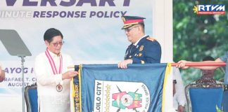 President Ferdinand Marcos Jr. hands the of Best City Police Office award to Iloilo City Police Office director Police Colonel Kim Legada during the Philippine National Police’s 124th Police Service Anniversary in Camp Crame, Quezon City, on Aug. 12, 2025. ICPO/ILOILO CITY GOV’T