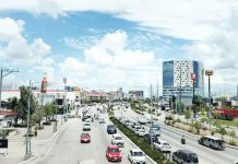 Traffic flows along Sen. Benigno Aquino Jr. Avenue in Iloilo City’s Mandurriao district, a bustling hub that continues to attract new businesses as the city posts steady growth in business permits and tax collections. MA. THERESA LADIAO/PN