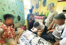 An Iloilo City Police Office operative wears a body-worn camera while documenting evidence seized during a buy-bust operation in La Paz, Iloilo City, in this undated photo. ICPO PHOTO