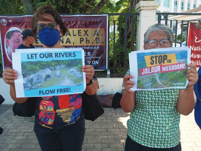 neljoy Tumandok (1) copy TUMANDOK CRY: STOP THE DAM. With placards demanding “Let our rivers flow free” and “Justice for Tumandok 9,” protesters in Iloilo rallied against the Jalaur River Multipurpose Project II, branding it a threat to ancestral lands, livelihoods, and indigenous survival. The demonstration renewed calls for justice over the 2020 killings of Tumandok leaders and put government agencies and contractors on the spot for what activists call a state-backed assault on people and the environment. JRMP PHOTO