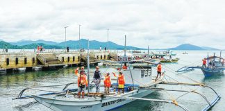 Members of the Iloilo Provincial Bantay Dagat Task Force aboard their patrol boat prepare to set out for another operation against illegal fishing in northern Iloilo waters. The persistence of illegal fishing highlights the difficulty of stamping out destructive practices even with intensified patrols and community programs.