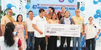 Representatives from the Municipality of Pototan, Iloilo receive a symbolic check worth P50,000 and a plaque after being hailed as the most Persons with Disabilities-friendly local government unit in Iloilo Province during the awarding ceremony at the capitol grounds on July 28, 2025, as part of the 47th National Disability Rights Week celebration. PHOTO FROM BALITA HALIN SA KAPITOLYO