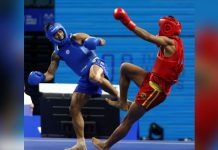Negrense Carlos Baylon Jr. battles Islam Karimov of Kazakhstan in a bronze medal game. PSC PHOTO