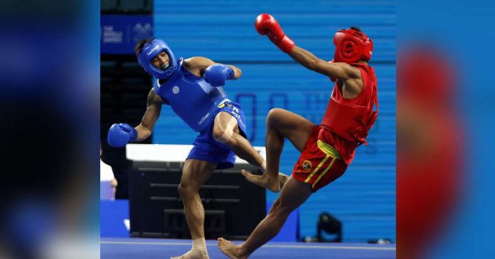 Negrense Carlos Baylon Jr. battles Islam Karimov of Kazakhstan in a bronze medal game. PSC PHOTO