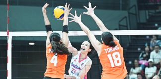 Creamline Cool Smashers’ Jessica Galanza scores against the defense of Farm Fresh Foxies' Caitlin Viray. PVL PHOTO