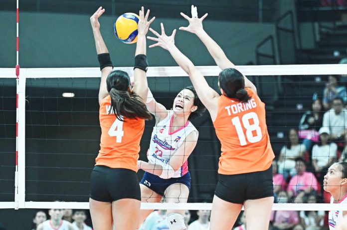 Creamline Cool Smashers’ Jessica Galanza scores against the defense of Farm Fresh Foxies' Caitlin Viray. PVL PHOTO
