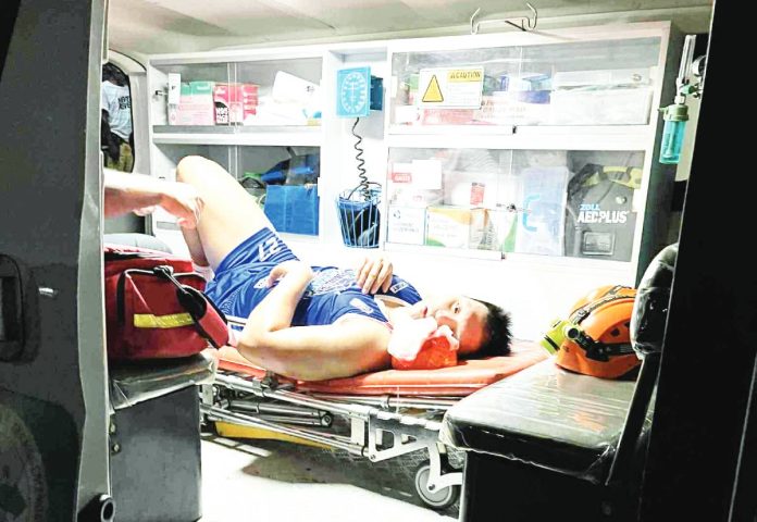 sports MPBL Jonas Tibayan is seen in the ambulance that brought him to the hospital. MPBL PHOTO