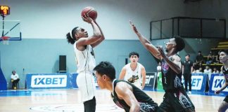 Bacolod Tubo Slashers’ Jaycee Adjei pulls up for a shot against the defense of Gensan Warriors’ Felix Apreku. MPBL PHOTO