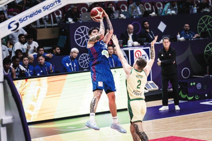 sports_Gilas_resized Gilas Pilipinas’ Kevin Quiambao pulls up for a three-pointer against Australia. FIBA PHOTO