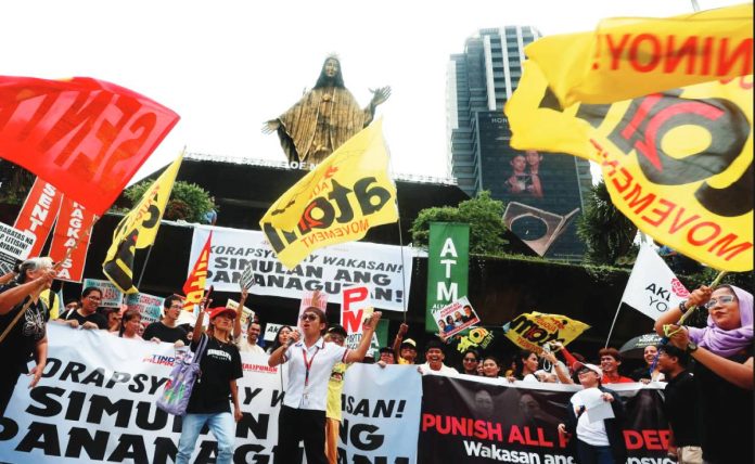 Activists and civil society groups troop to the EDSA Shrine in Quezon City Sept. 11, 2025 to protest anomalous flood control projects. They are calling for accountability from government officials and contractors. The groups say the massive misuse of public funds worsens flooding problems faced by communities. INQUIRER/ MARIANNE BERMUDEZ