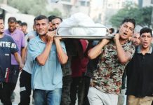 Israel committing genocide in Gaza, world’s leading experts say Male mourners carry a body during the funeral for Palestinians killed in strikes, according to medics, at Al-Shifa Hospital in Gaza City. REUTERS