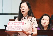Hong Kong lawmakers buck more rights for gay couples Hong Kong Lawmaker Maggie Chan makes a speech from a lectern adorned with a red and white sign that says in Chinese “resolutely oppose registration of same‑sex partnerships ordinance”. AFP
