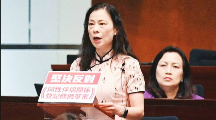 Hong Kong Hong Kong Lawmaker Maggie Chan makes a speech from a lectern adorned with a red and white sign that says in Chinese “resolutely oppose registration of same‑sex partnerships ordinance”. AFP