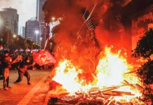 Demonstrators burned road barriers outside the Jakarta police headquarters. EPA