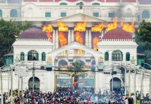 Fire and smoke rise from the Singha Durbar palace, which houses government and parliament buildings, as protesters storm the premises in Kathmandu, Nepal. EPA/Shutterstock