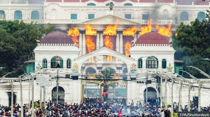 Nepal (1) Fire and smoke rise from the Singha Durbar palace, which houses government and parliament buildings, as protesters storm the premises in Kathmandu, Nepal. EPA/Shutterstock