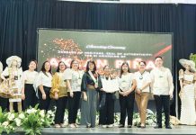 Anna India Legaspi (center), president of the Aklan Piña & Indigenous Fibers Manufacturers and Traders Association, Inc. (Aklan Piña Mantra), receives the Certificate of Geographical Indication (GI) Registration for Aklan piña during the awarding ceremony held on September 19 in Kalibo, Aklan. DTI-6 PHOTO