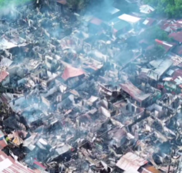 bacolod fire2 This aerial shot shows the aftermath of a three-hour fire that hit Purok Cheriza, Barangay 27, Bacolod City early Friday morning, September 12, 2025. The Bureau of Fire Protection-Bacolod City said at least 180 houses were destroyed and 36 others were damaged. REYNAN LARIDA/FACEBOOK PHOTO