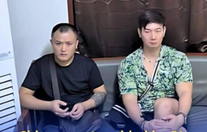 These two Chinese nationals were arrested by Bureau of Immigration intelligence agents after being found working and managing a restaurant in the famous beach area of Boracay in Malay, Aklan, on Monday, Sept. 22, 2025. BUREAU OF IMMIGRATION PHOTO