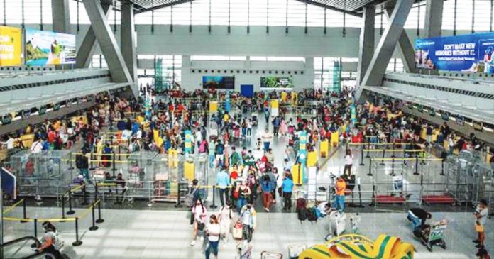 Travelers arrive at the Ninoy Aquino International Airport (NAIA) Terminal 3 in Pasay City. President Ferdinand Marcos Jr. has ordered the Department of Transportation to assist travelers affected by the inclement weather. JONATHAN CELLONA, ABS-CBN NEWS FILE PHOTO
