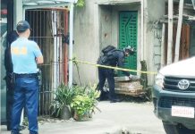 A member of the Explosive Ordnance Disposal (EOD) team of the Iloilo City Police Office inspects an unattended parcel outside a residence in Barangay San Vicente, Jaro, Iloilo City, on September 9, as police secure the perimeter following a bomb scare. AJ PALCULLO/PN
