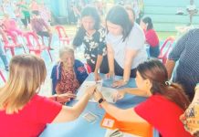 MILESTONE AID FOR ELDERLY: 13,000 Western Visayas seniors now enjoy P10K each under expanded recognition law A senior citizen in Iloilo City receives her P10,000 milestone cash gift under the Expanded Centenarians Act of 2023 during a payout ceremony in Barangay Quintin Salas, Jaro district on Sept. 13, 2025. “While waiting for their payout, we made sure our lolo and lola had time to relax. We provided free haircuts, manicures, and massage services so that it felt more like a celebration than just a distribution,” says Mayor Raisa Treñas (standing, right). DYRI RMN ILOILO PHOTO