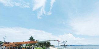 Crews from the National Grid Corporation of the Philippines and Aklan Electric Cooperative rush to stabilize poles along the beachside perimeter after Boracay Island and nearby Aklan towns suffered a weekend-long blackout. AKELCO FB PAGE PHOTO