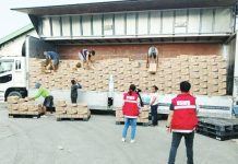 READY BUT WARY: Heed advisories, DSWD-6 urges as ‘Opong’ nears WV Department of Social Welfare and Developmenr personnel oversee the unloading of prepositioned Family Food Packs in Iloilo as part of the agency’s preparations for Tropical Storm “Opong”. DSWD-6 PHOTO