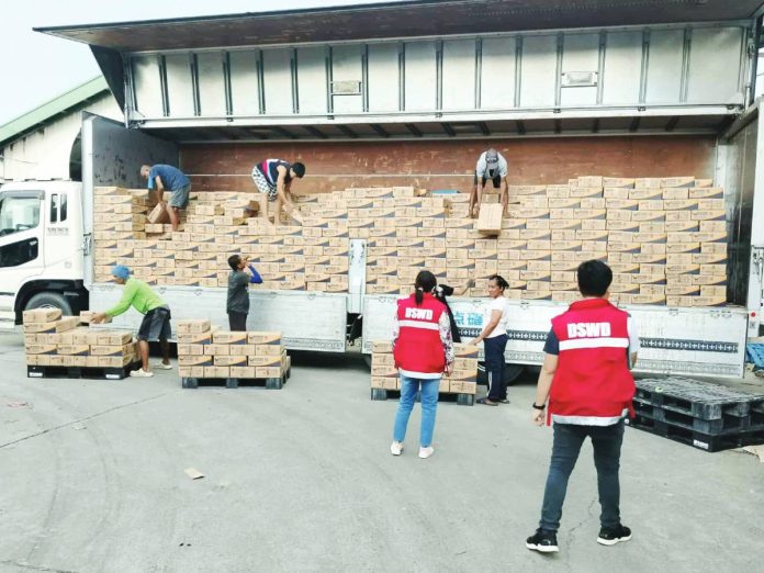 Department of Social Welfare and Developmenr personnel oversee the unloading of prepositioned Family Food Packs in Iloilo as part of the agency’s preparations for Tropical Storm “Opong”. DSWD-6 PHOTO