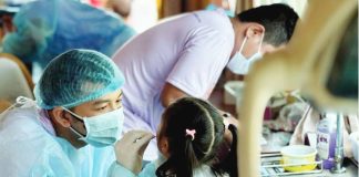 Healthcare workers provide free dental and immunization services to children during the Family Health and Nutrition Fair in Concepcion, Iloilo, which served over 300 residents. ILOILO PROVINCIAL HEALTH OFFICE PHOTO