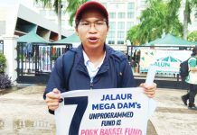 Jalaur River for the People’s Movement spokesperson Arlie Bosque voices strong opposition to the Jalaur mega dam project during a protest in Iloilo City, stressing, “Our call extends beyond merely reviewing the dam project; it’s a plea to prioritize public welfare, especially in education and health, over infrastructural projects that serve to deepen corruption.” NELJOY N. GALIGAO /PN