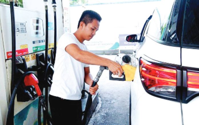 oil_price_upticks_resized A gas station attendant refuels a vehicle in this undated photo. Oil companies on Monday, Sept. 15, said price of gasoline will increase by P0.10 per liter, diesel by P0.50 per liter, and kerosene by P0.10 per liter today, Sept. 16. PNA PHOTO BY BEN BRIONES