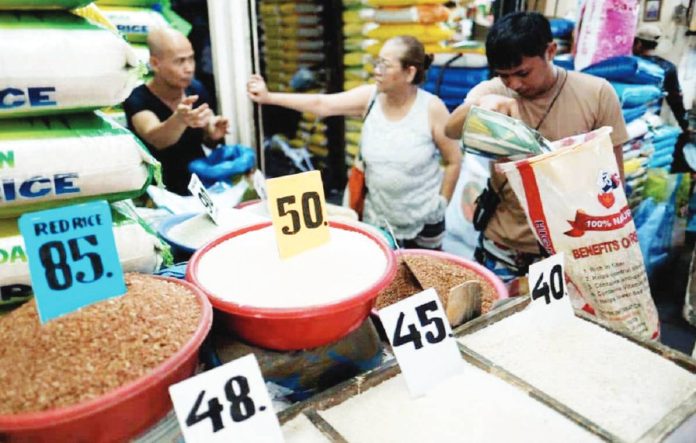 rice_prices_resized A rice merchant sells affordable and quality rice at a stall in Marikina Public Market in Marikina City. The National Food Authority is increasing purchases of local palay to beef up its buffer stock. GRIG C. MONTEGRANDE PHOTO