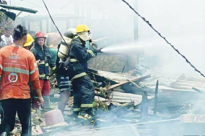 Twenty-one houses were totally destroyed and three were partially damaged in a fire that struck Barangay 5 in San Carlos City, Negros Occidental on Wednesday morning, Sept. 3, displacing 65 residents. WATCHMEN DAILY JOURNAL PHOTO