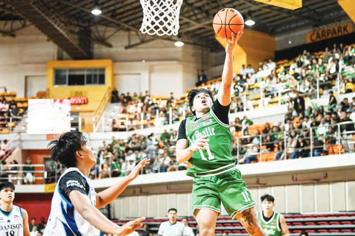 sports Archers De La Salle University Green Archers' Jacob Cortez attacks the basket for a layup. UAAP PHOTO