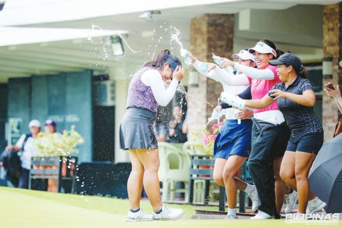 sports Bisera Florence Bisera is showered with water after her come-from-behind win in ICTSI Negros Occidental Classic. ICTSI PHOTO